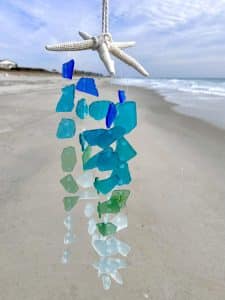 Sea glass wind chime on beach